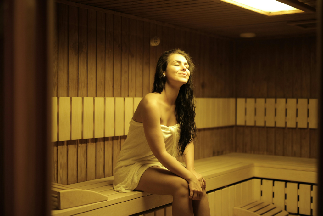 A person relaxing in a sauna