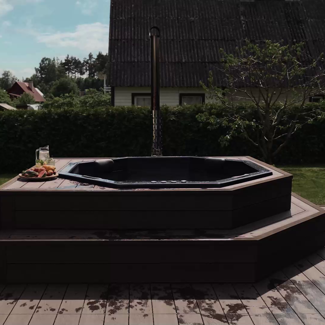 Hot tub on a wooden deck with a scenic background