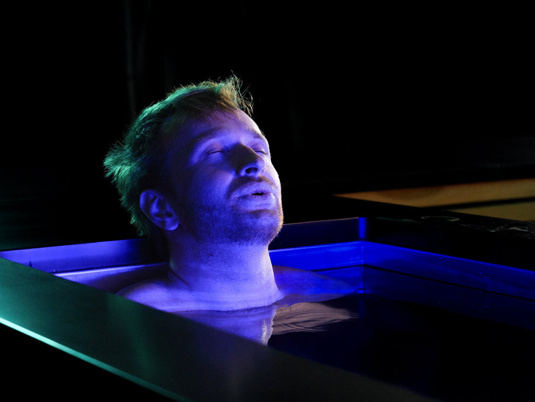 Someone cold plunging in an icebath