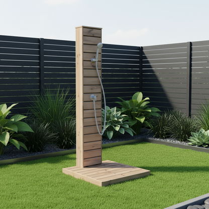 Wooden outdoor shower in a garden setting with plants and a fence.
